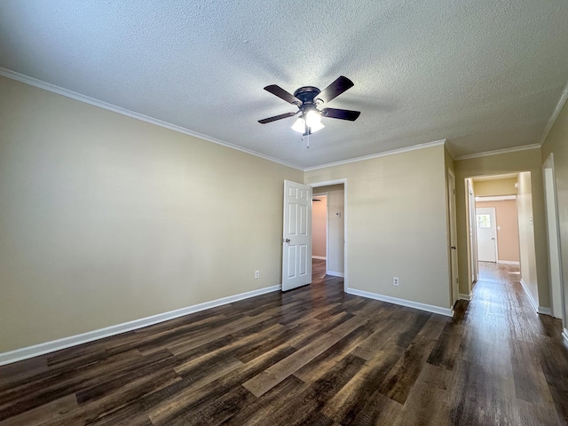 unfurnished bedroom with dark wood-type flooring, baseboards, and ornamental molding