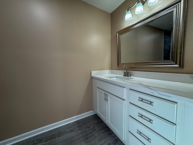 bathroom featuring vanity and baseboards