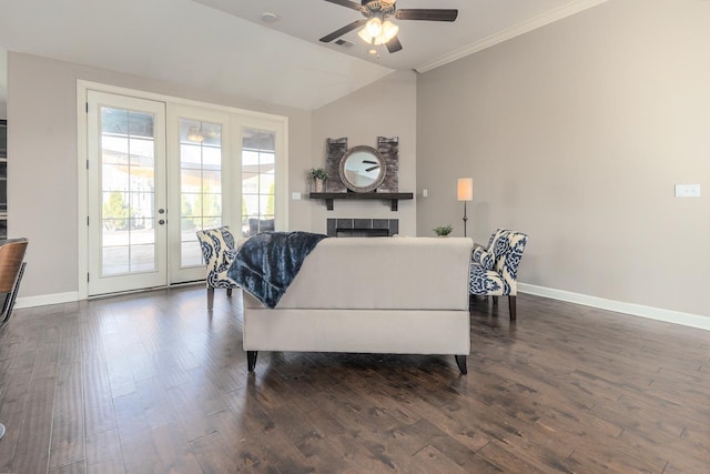 living room with dark wood-type flooring, baseboards, a tile fireplace, french doors, and a ceiling fan