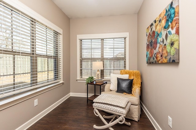 sitting room with wood finished floors and baseboards