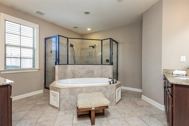 full bathroom with tile patterned floors, a shower stall, a bath, and vanity