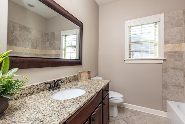 full bathroom with tile patterned floors, toilet, vanity, and baseboards