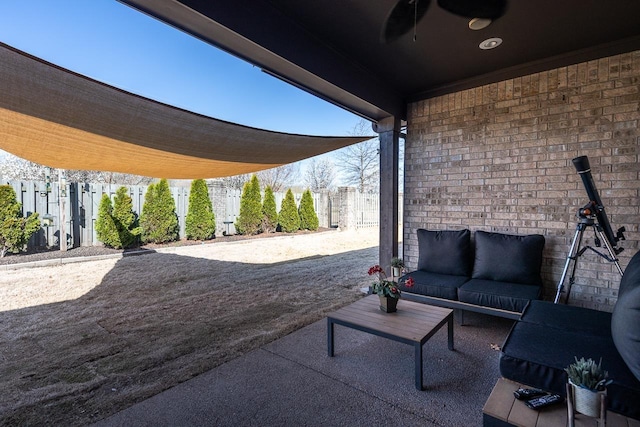 view of patio with fence and an outdoor hangout area