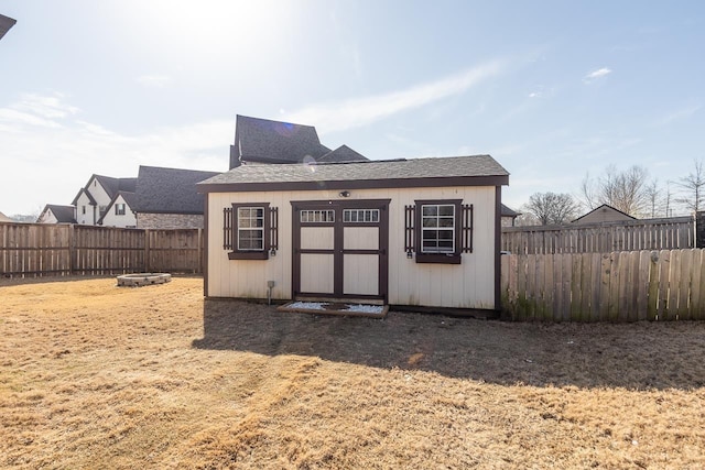 view of outbuilding featuring an outbuilding and a fenced backyard