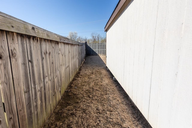 view of property exterior with fence private yard