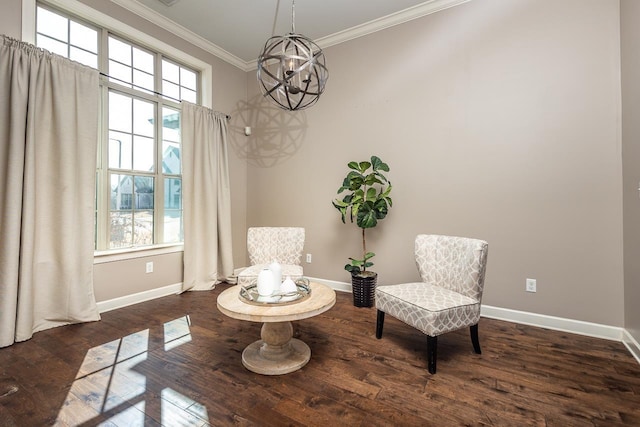 sitting room featuring plenty of natural light, wood finished floors, and crown molding