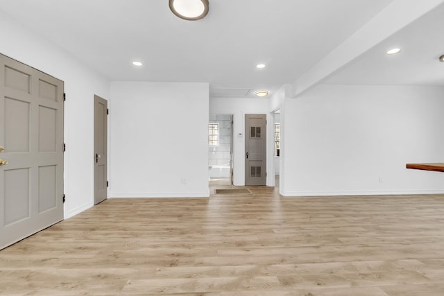 interior space with light wood-style flooring, recessed lighting, and baseboards