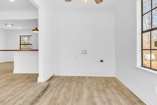 unfurnished room with ceiling fan, baseboards, and wood finished floors