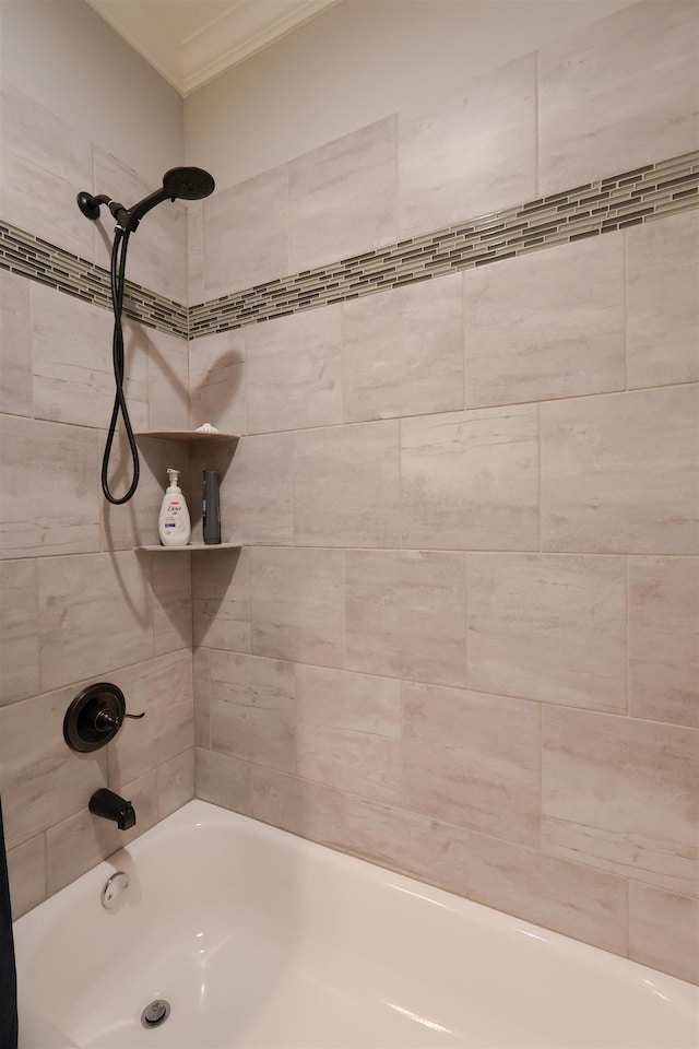 full bathroom featuring washtub / shower combination and crown molding