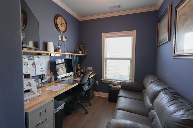 office area with visible vents, baseboards, wood finished floors, and crown molding