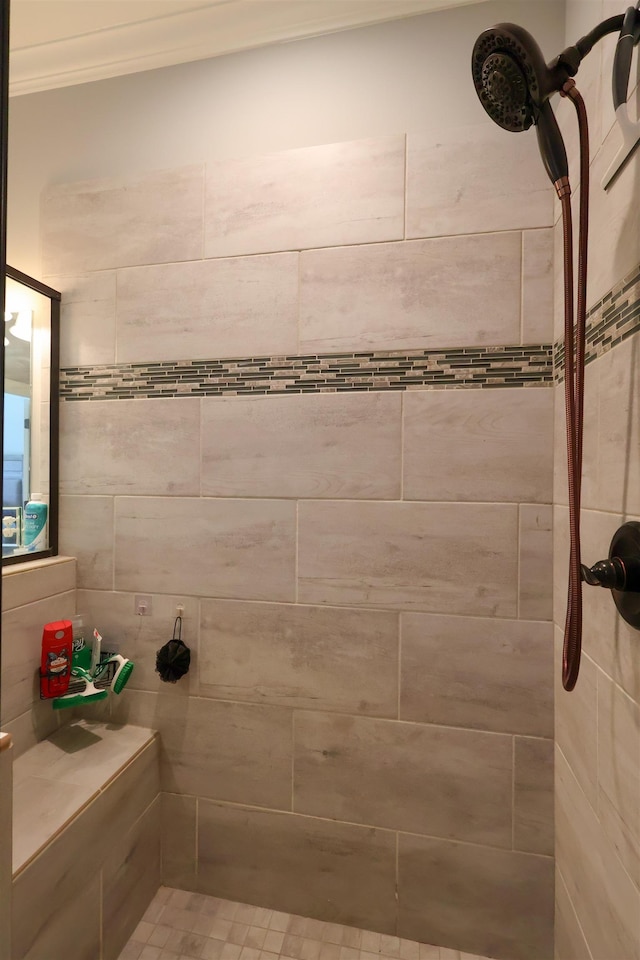 bathroom featuring tiled shower