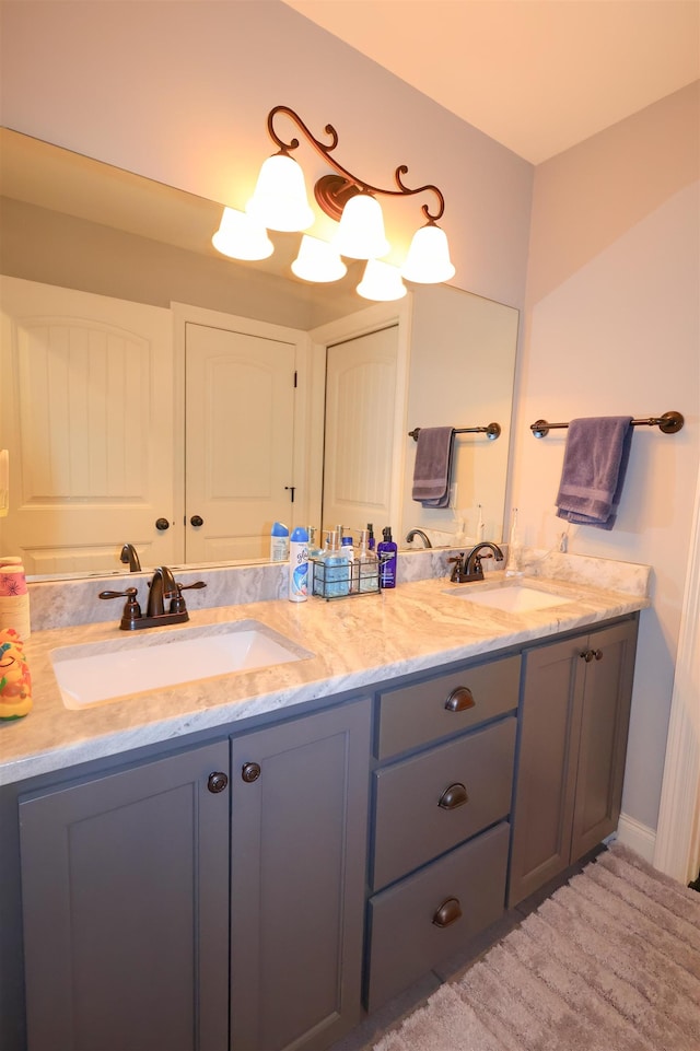 full bathroom featuring a sink and double vanity