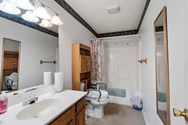 bathroom with toilet, vanity, and a shower with curtain