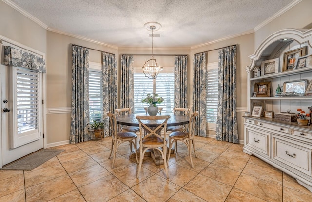 dining room with a chandelier, a textured ceiling, and crown molding