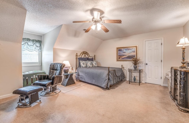 bedroom featuring lofted ceiling, light colored carpet, ceiling fan, and a textured ceiling