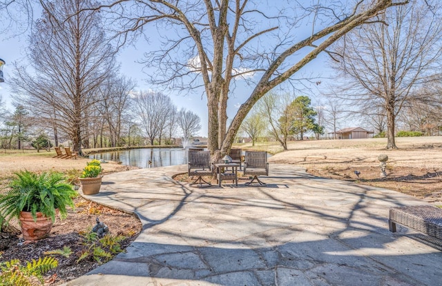 view of patio featuring a water view