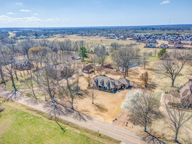 birds eye view of property with a rural view