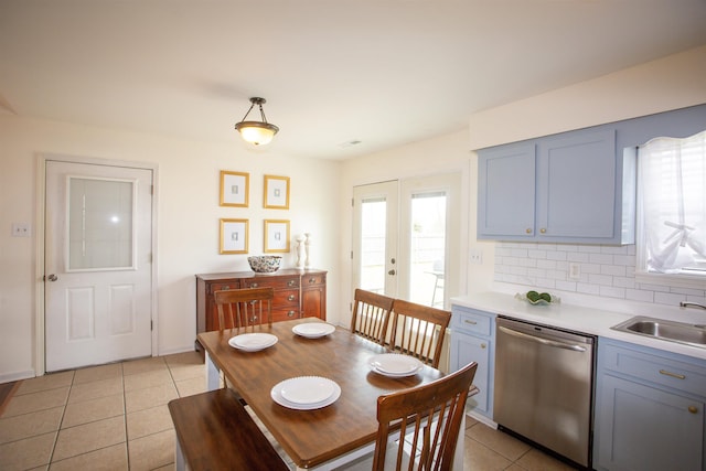 dining area featuring light tile patterned flooring and french doors