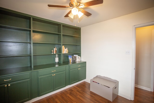 interior space featuring baseboards, wood finished floors, and ceiling fan