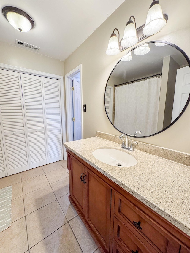 full bathroom featuring tile patterned floors, visible vents, and vanity