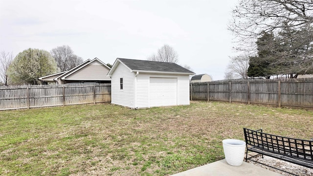 view of yard featuring an outbuilding and a fenced backyard