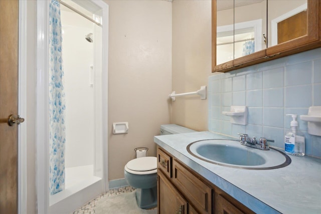 full bathroom with tasteful backsplash, a stall shower, toilet, and vanity