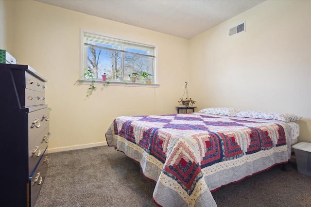 bedroom with visible vents, baseboards, and carpet