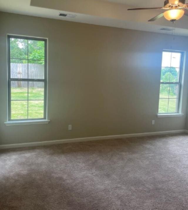 7718 Parkridge Dr, Southaven, MS 38671 - spare room with ceiling fan, baseboards, visible vents, and carpet floors