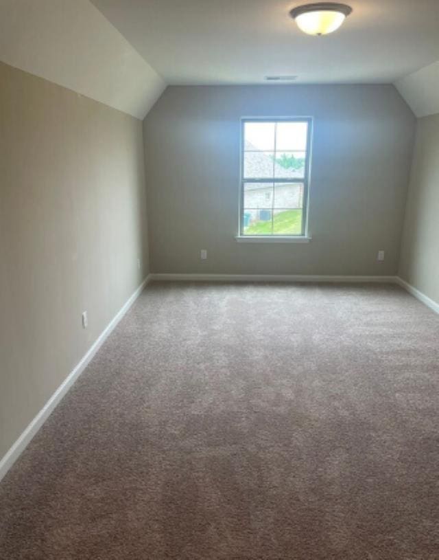 7718 Parkridge Dr, Southaven, MS 38671 - bonus room featuring baseboards, carpet, and vaulted ceiling