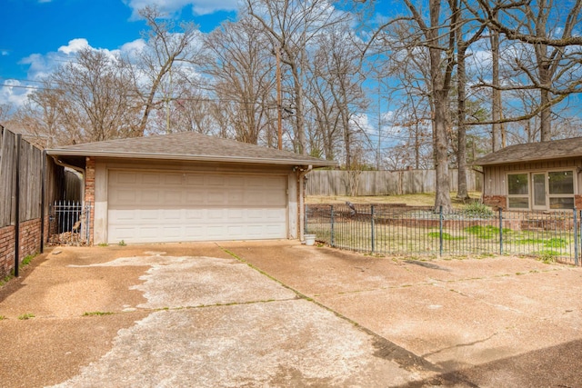 detached garage featuring fence