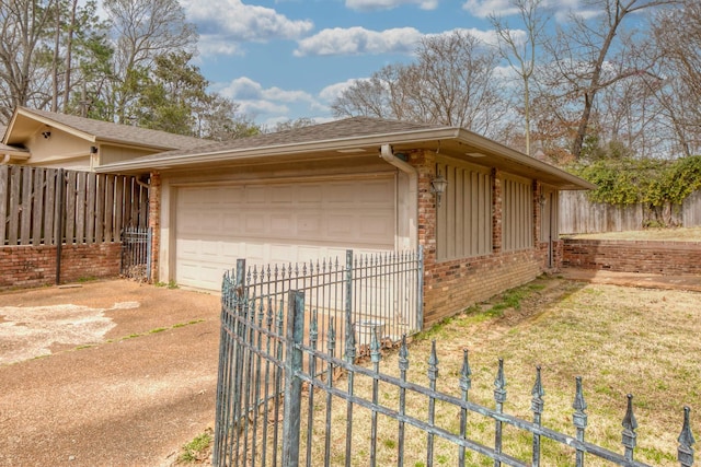 exterior space featuring driveway and fence