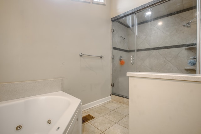 full bath with a tub with jets, baseboards, visible vents, a stall shower, and tile patterned floors