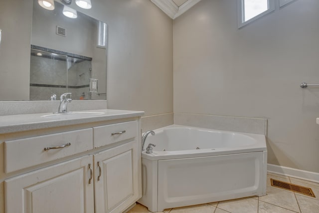 bathroom featuring tile patterned floors, visible vents, a jetted tub, and vanity