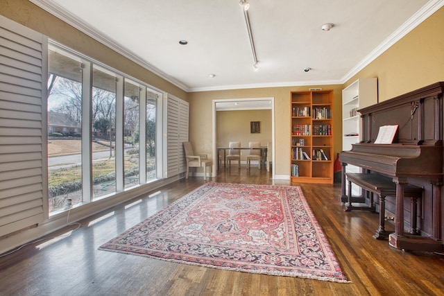 living area with wood finished floors and crown molding