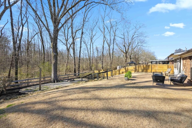 view of yard with a patio and fence