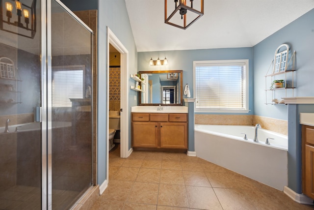 full bathroom with vanity, a shower stall, a garden tub, and tile patterned floors