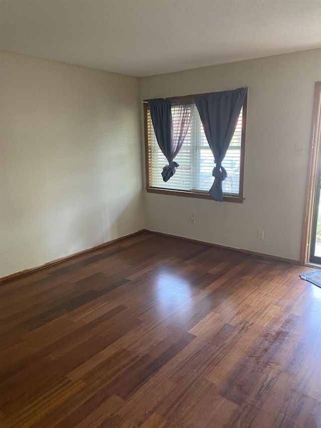 576 Monteagle Dr, Memphis, TN 38109 - empty room featuring dark wood finished floors and baseboards
