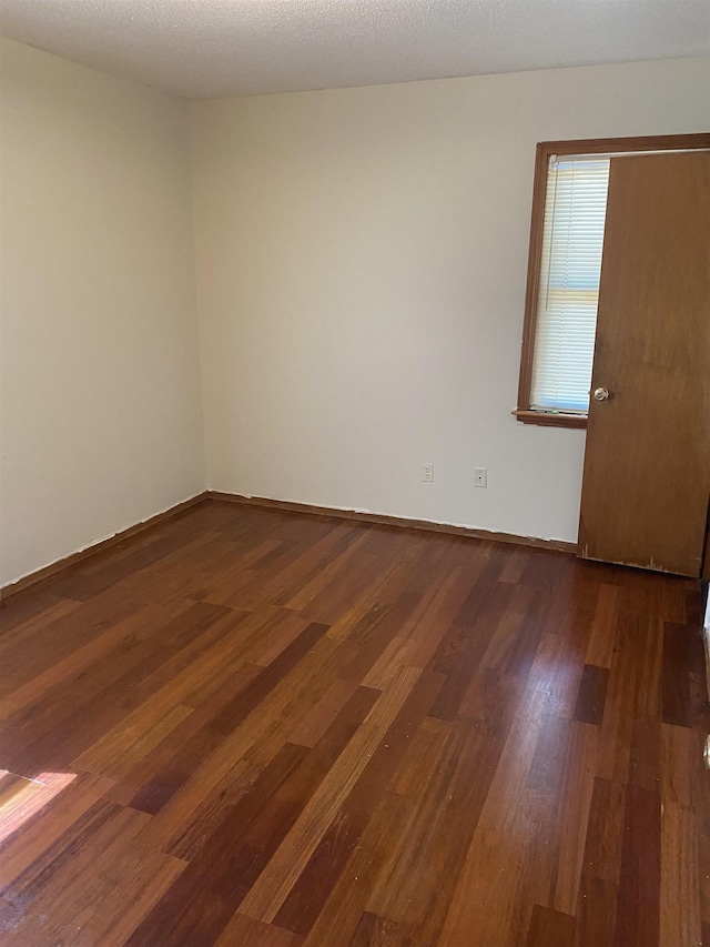 576 Monteagle Dr, Memphis, TN 38109 - spare room with dark wood-type flooring and baseboards