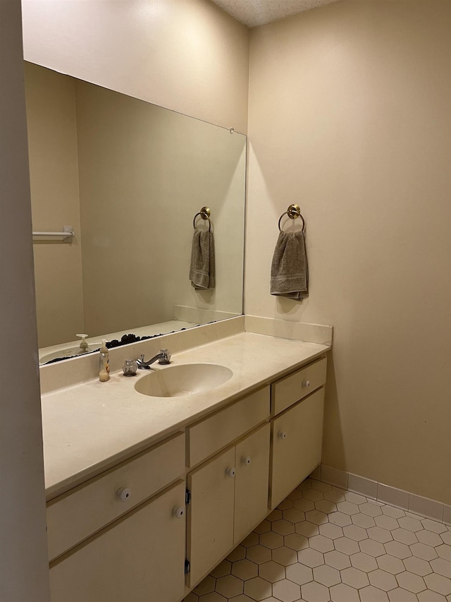 bathroom featuring vanity and baseboards