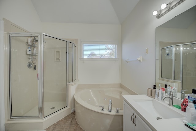 full bathroom with vanity, tile patterned flooring, a shower stall, vaulted ceiling, and a jetted tub