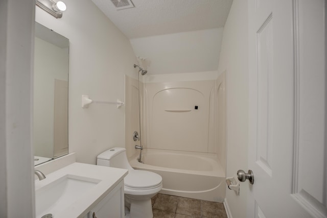 bathroom featuring visible vents, washtub / shower combination, toilet, vanity, and a textured ceiling