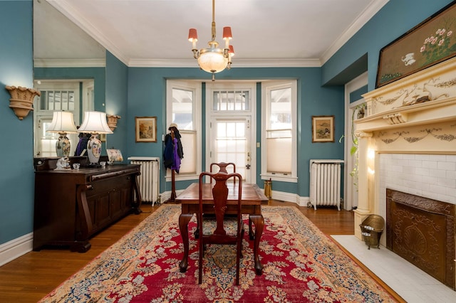 1860 Central Ave, Memphis, TN 38104 - dining space featuring radiator heating unit and wood finished floors