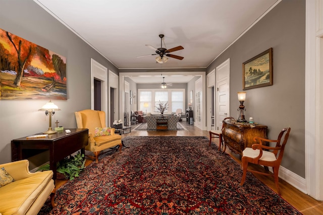 1860 Central Ave, Memphis, TN 38104 - living area with baseboards, crown molding, ceiling fan, and wood finished floors