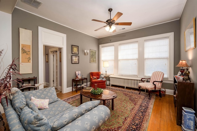 1860 Central Ave, Memphis, TN 38104 - living area with visible vents, wood finished floors, ornamental molding, and a ceiling fan