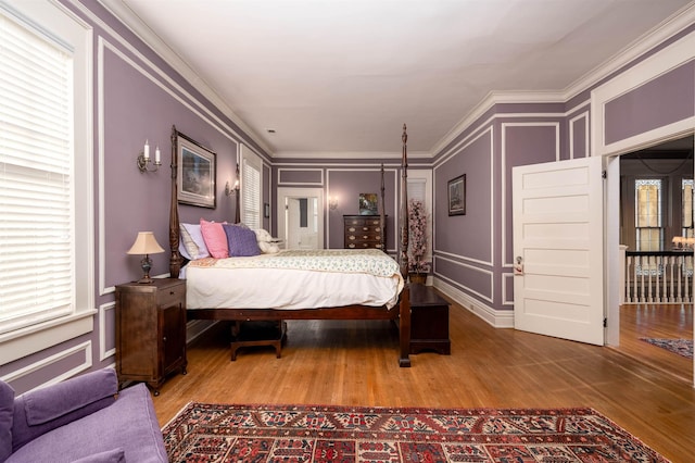 1860 Central Ave, Memphis, TN 38104 - bedroom featuring wood finished floors, crown molding, and a decorative wall