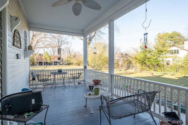 1860 Central Ave, Memphis, TN 38104 - wooden terrace with a ceiling fan
