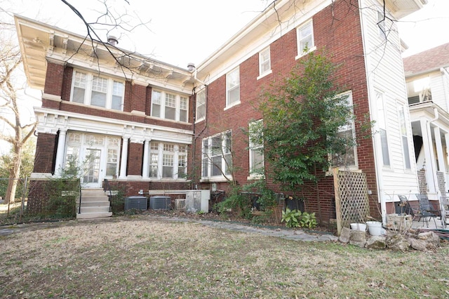 1860 Central Ave, Memphis, TN 38104 - exterior space featuring brick siding, central AC unit, and entry steps