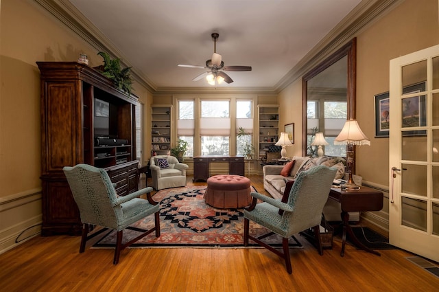 1860 Central Ave, Memphis, TN 38104 - living area with ceiling fan, visible vents, a wealth of natural light, and wood finished floors