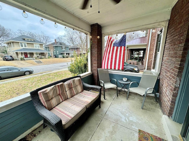 view of patio with a residential view, a porch, a ceiling fan, and outdoor lounge area