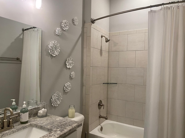 full bath featuring shower / bathtub combination with curtain, toilet, and vanity